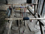Loom for weaving the narrow strips of traditional cloth