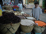 Grains and spices.  The closest basket is full of hibiscus leaves for hibiscus tea - karkaday.